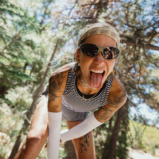 Trail runner wearing the SMITH Sliders sunglasses